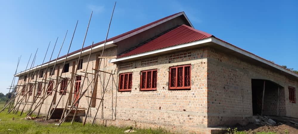 A House With Wooden Logs Placed for Framework