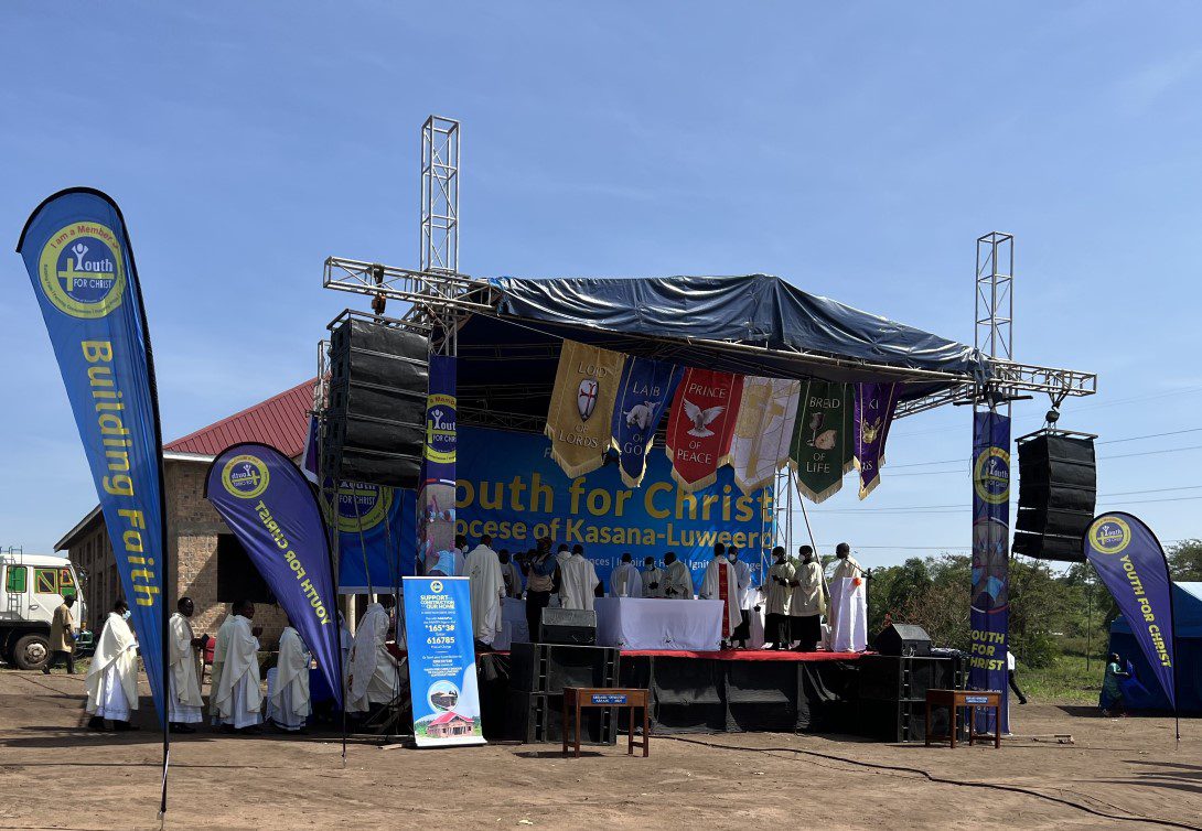 Outdoor Youth for Christ stage with clergy