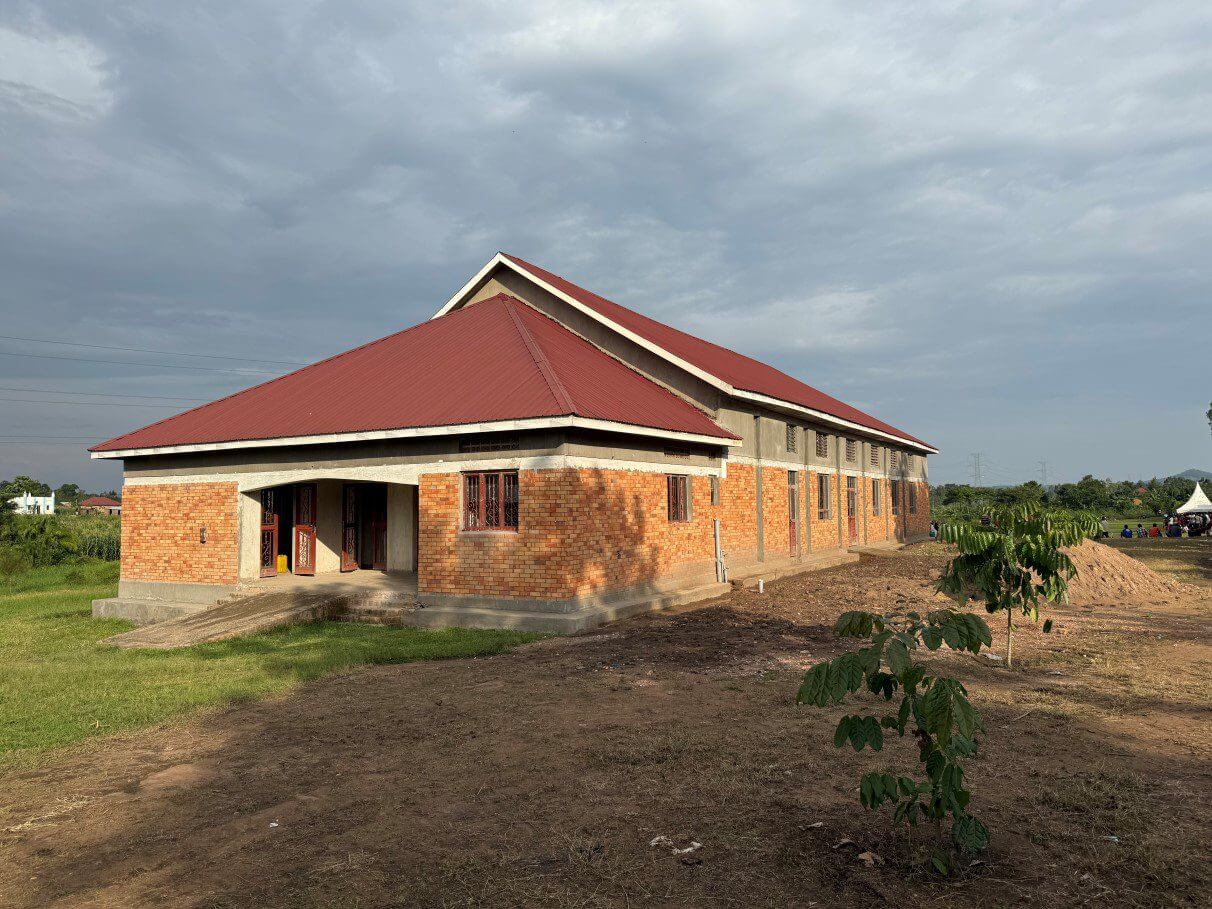 Brick rural community hall with red metal roof